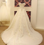 Load image into Gallery viewer, Lace And Crystal Beaded Sweetheart See Through Wedding Dresses Ball Gowns
