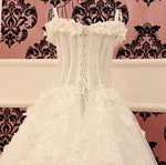 Load image into Gallery viewer, Lace And Crystal Beaded Sweetheart See Through Wedding Dresses Ball Gowns
